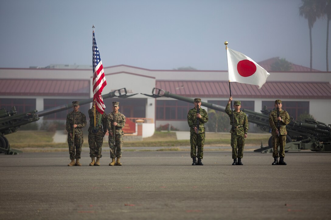 MARINE CORPS BASE CAMP PENDLETON, Calif. – Marines with 1st Battalion, 4th Marines, 1st Marine Division and Western Army Infantry Regiment, Japan Ground Self Defense Force stand in formation as part of the Exercise Iron Fist 2018 opening ceremony on Jan. 12. Exercise Iron Fist is a five-week-long exercise focusing on advanced marksmanship, amphibious reconnaissance, fire and maneuver assaults, staff planning, logistical support, medical knowledge sharing, fire support operations, including mortars, artillery and close air support, and amphibious landing operations. (U.S. Marine Corps photo by Cpl. Jacob A. Farbo)