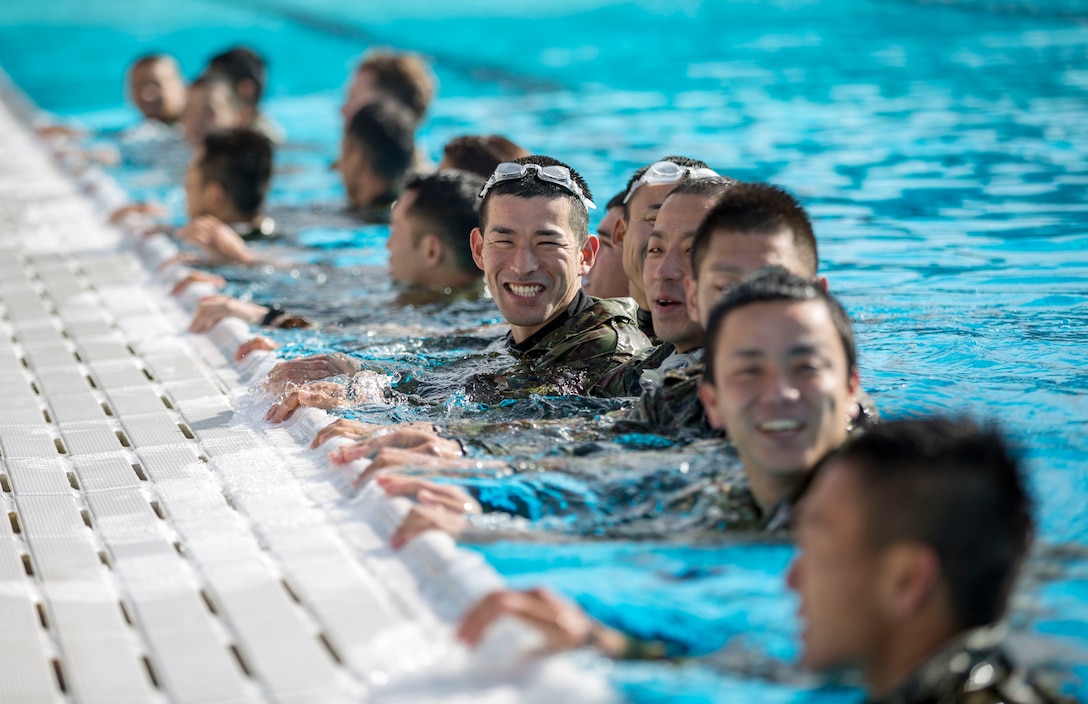 MARINE CORPS BASE CAMP PENDLETON, Calif. – Japan Ground Self Defense Force soldiers participate in a Marine Corps intermediate swim qualification as part of exercise Iron Fist Jan. 16, 2018. Iron Fist brings together U.S. Marines from the 11th Marine Expeditionary Unit and Soldiers from the Japan Ground Self Defense Force, Western Army Infantry Regiment, to improve bilateral planning, communicating, and conduct combined amphibious operations. (U.S. Marine Corps Photo by Cpl. Jacob A. Farbo)