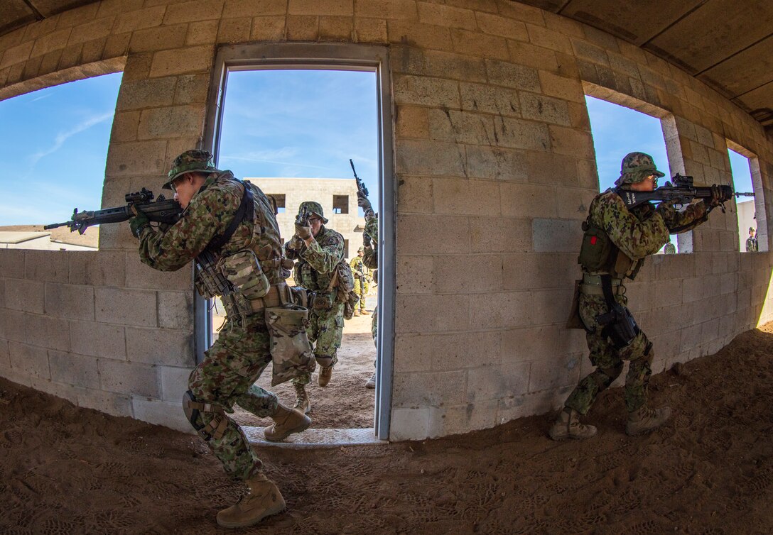 MARINE CORPS BASE CAMP PENDLETON, Calif. - Soldiers with the Western Army Infantry Regiment, Japan Ground Self Defense Force, enter a building from a stack formation during Military Operations on Urban Terrain training during exercise Iron Fist 2018, Jan. 17. When clearing a building, team members work together to maximize their deadly force while protecting each other. Iron Fist is an annual, bilateral training exercise held in Southern California between the U.S. Marine Corps and the JGSDF.