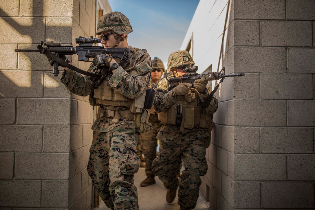 MARINE CORPS BASE CAMP PENDLETON, Calif. - Marines with 1st Combat Engineer Battalion clear hallways during exercise Iron Fist 2018, Jan. 18. Exercise Iron Fist is an annual bilateral training exercise where U.S. and Japanese service members train together and share technique, tactics and procedures to improve their combined operational capabilities. (U.S. Marine Corps photo by Lance Cpl. Robert Alejandre)