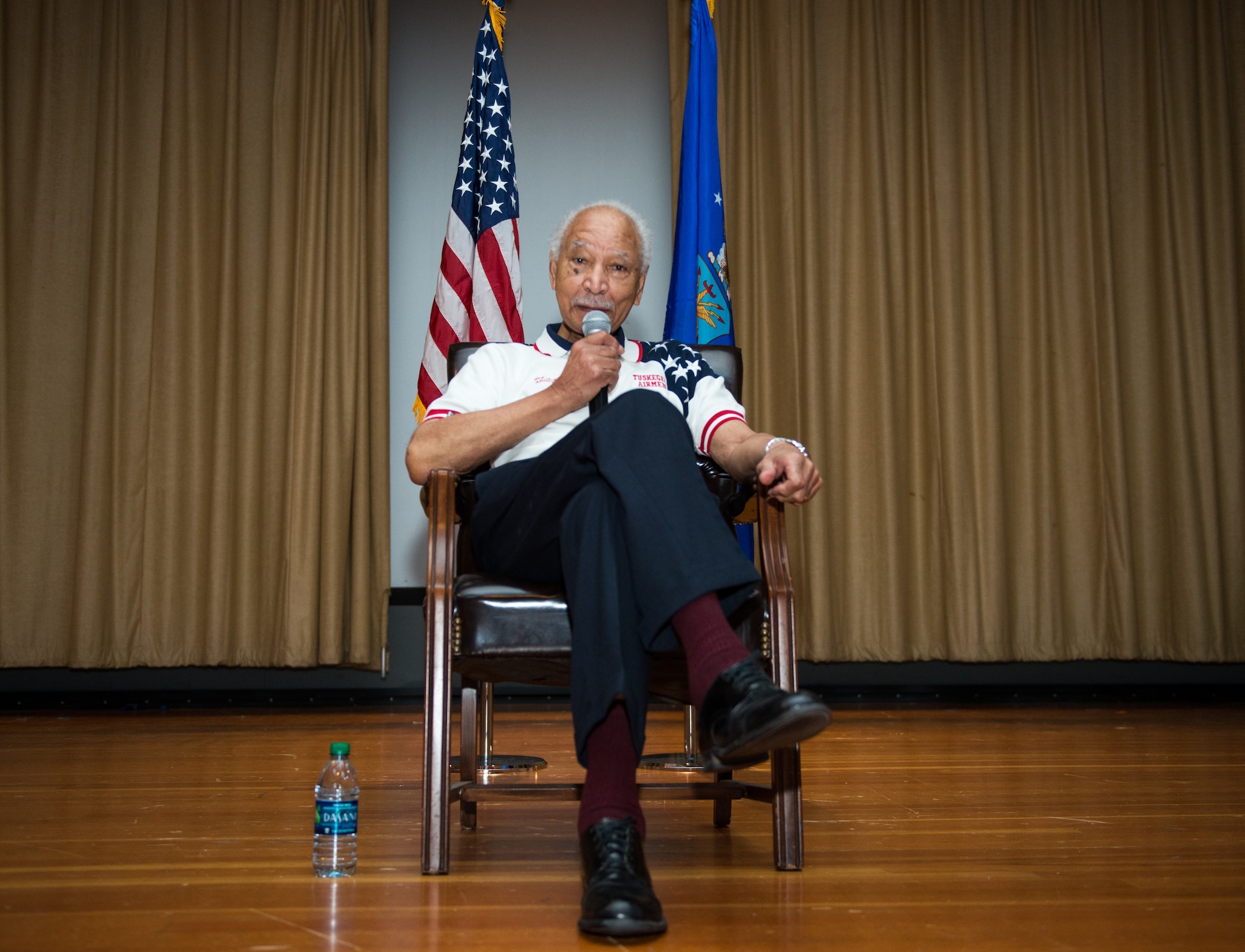 Retired Lt. Col. Robert Ashby, Tuskegee Airman, speaks to Thunderbolts during the 2018 Tuskegee Airmen Honor Event at Luke Air Force Base, Ariz., Feb. 15, 2018. During the event, Ashby spoke about the significant contributions and achievements made by the Tuskegee Airmen that helped shape aviation history. (U.S. Air Force photo/ Airman 1st Class Alexander Cook)