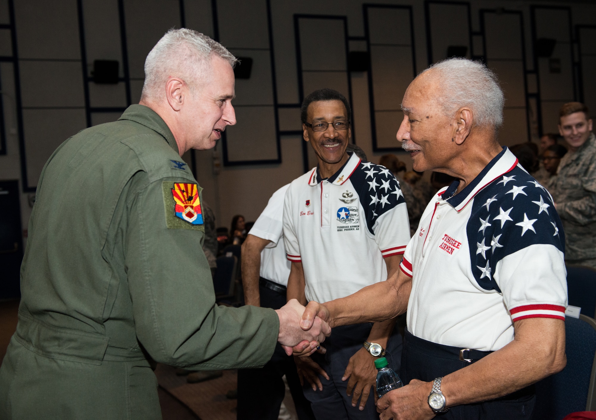 Col. Michael Richardson, 56th Fighter Wing vice commander, shakes hands with retired Lt. Col. Robert Ashby, Tuskegee Airman, during the 2018 Tuskegee Airmen Honor Event at Luke Air Force Base, Ariz., Feb. 15, 2018. Following the event, Airmen participated in a meet-and-greet with Ashby to thank him for the contributions made to the Air Force throughout his career. (U.S. Air Force photo/ Airman 1st Class Alexander Cook)