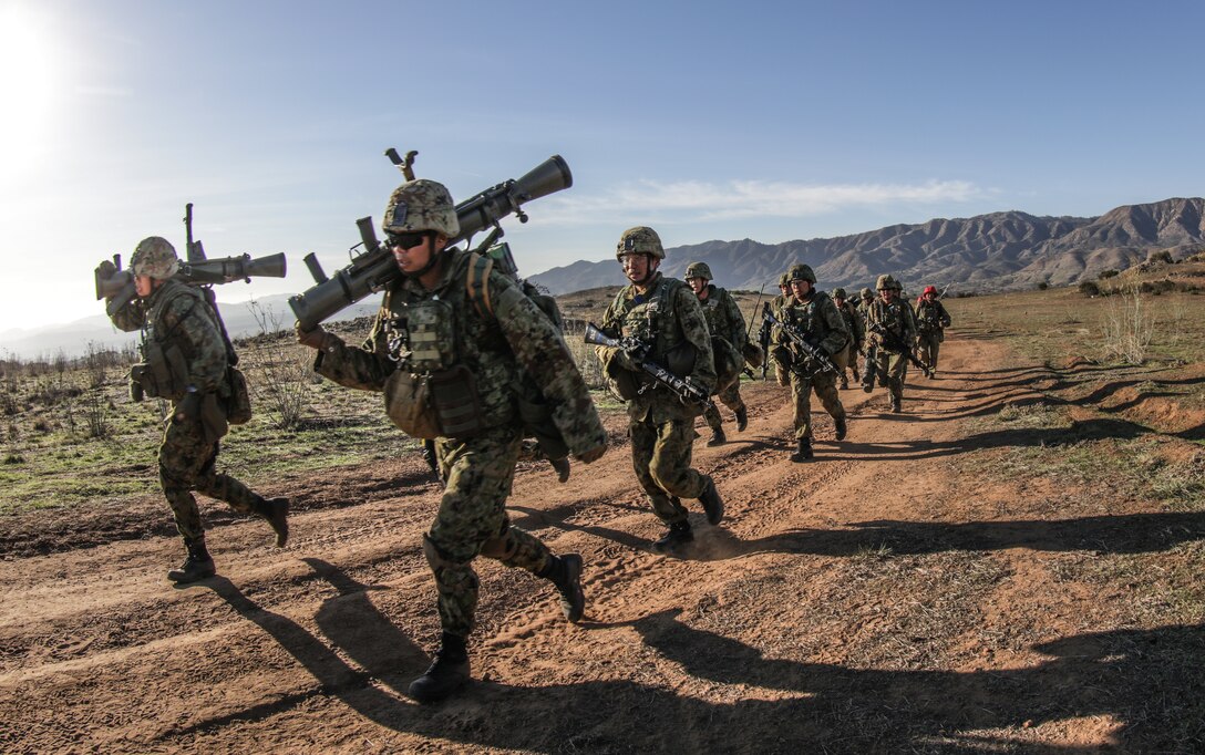 MARINE CORPS BASE CAMP PENDLETON, Calif. – Soldiers with the Western Army Infantry Regiment, Japan Ground Self Defense Force run to their next objective during a live fire and maneuver range aboard Marine Corps Base Camp Pendleton during exercise Iron Fist 2018, Jan. 18. Iron Fist is a five-week-long exercise between the United States Marine Corps and JGSDF focusing on advanced marksmanship, amphibious reconnaissance, fire and maneuver assaults, staff planning, logistical support, medical knowledge sharing, fire support operations, including mortars, artillery and close air support, and amphibious landing operations. (U.S. Marine Corps Photo by Gunnery Sgt. Robert B. Brown Jr.)