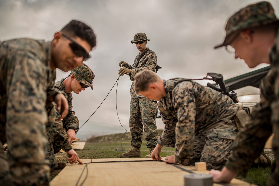 MARINE CORPS BASE CAMP PENDLETON, Calif. – U.S. Marines with 1st Combat Engineer Battalion prepares demolition cable to conduct a simulated roof breach while conducting Urban Explosive Demolitions training during exercise Iron Fist 2018, Jan. 19. Exercise Iron Fist is an annual bilateral training exercise where U.S. and Japanese service members train together and share technique, tactics and procedures to improve their combined operational capabilities. (U.S. Marine Corps photo by Lance Cpl. Robert Alejandre)