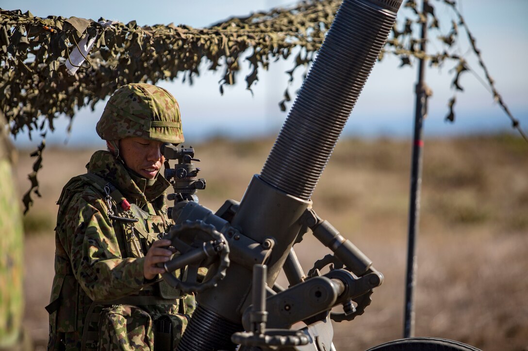 MARINE CORPS BASE CAMP PENDLETON, Calif. – A Japan Ground Self Defense Force Soldier aims down the sights of a Dragon Fire 120-Millimeter Heavy Mortar on San Clemente Island during exercise Iron Fist 2018, Feb. 2. Exercise Iron Fist brings together U.S. Marines from the 11th Marine Expeditionary Unit and Soldiers from the JGSDF, Western Army Infantry Regiment, to improve their bilateral planning, communicating, and conducting of combined amphibious operations. (U.S. Marine Corps photo by Cpl. Jacob A. Farbo)