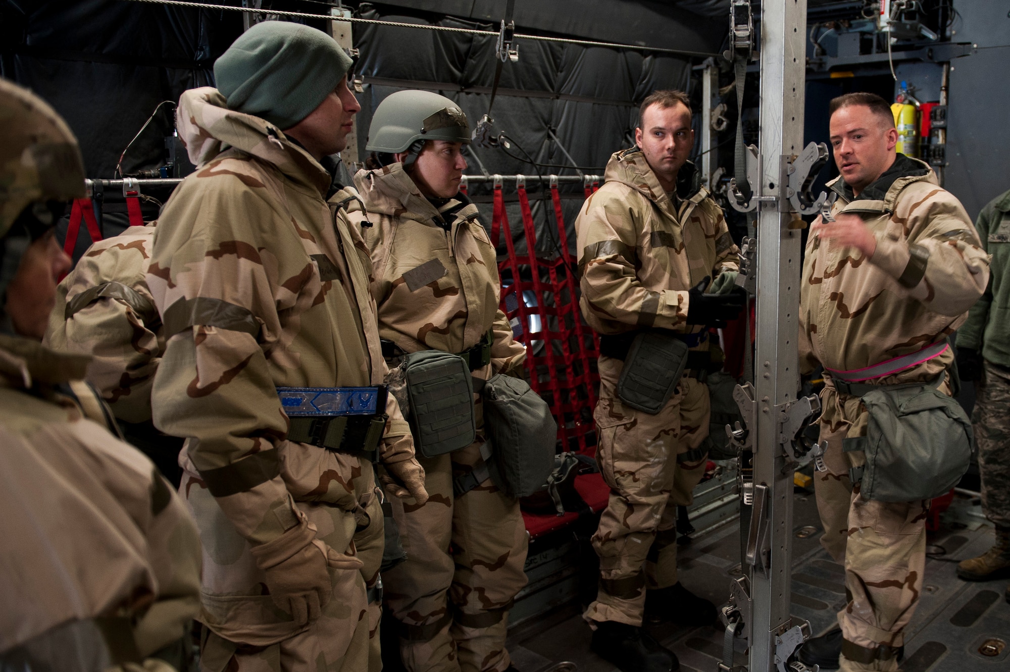 Tech. Sgt. Jacob Appleby, 375th Aeromedical Evacuation Squadron mission management NCO in charge, explains how to prepare the inside of a C-130 Hercules for patient transport during an exercise at Scott Air Force Base, Illinois, Feb. 6, 2018. The 375th AES provides rapid response aeromedical evacuation capability for any contingency. (U.S. Air Force photo by Staff Sgt. Clayton Lenhardt)