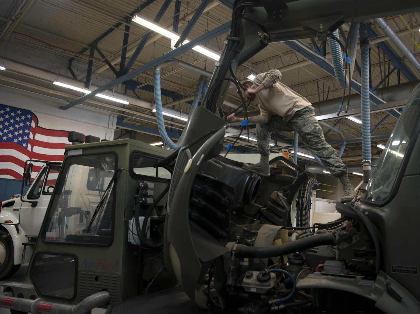 U.S. Air Force Senior Airman John Hipple, 628th Logistics Readiness Squadron, mission generation vehicular equipment maintenance journeyman, replaces hydraulic lines on a vehicle in the LRS main shop Feb. 15.
