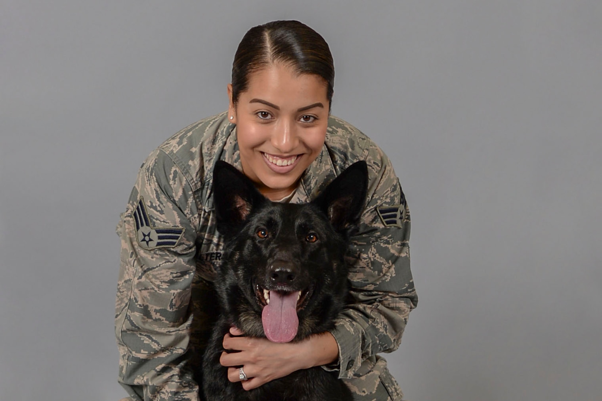 Senior Airman Katherine Walters, 375th Air Mobility Wing Public Affairs broadcast journalist, and her German Shepherd, Jodi, have been utilizing the Scott Air Force Base Veterinary Treatment Facility for 2 years. Walters has greatly appreciated the amount of care and support her and Jodi have received at the clinic. (U.S. Air Force photo by Senior Airman Melissa Estevez)