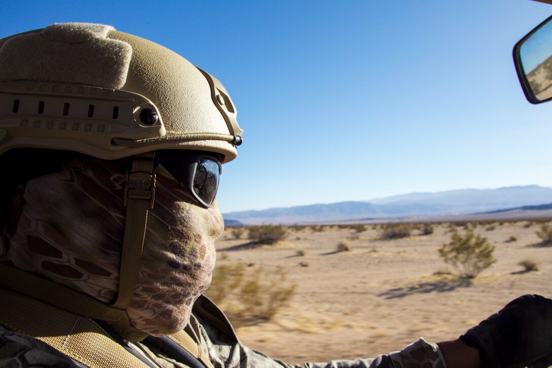 Jovan Roberts, conservation law enforcement officer, Environmental Affairs, patrols the Marine Corps Air Ground Combat Center's western boundary in Twentynine Palms, Calif., during the King of the Hammers off-road racing and rock-crawling event, Feb. 7, 2018. CLEOs work to protect and preserve the base's many natural and cultural resources. (U.S. Marine Corps photo by Cpl. Dave Flores)
