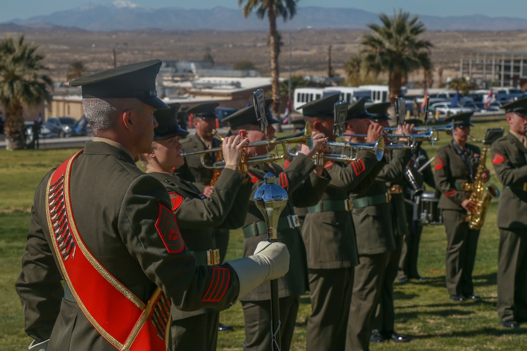 Marines with the 1st Marine Division band begin the pre-ceremony serenade before the deactivation ceremony of D Company "Dragoons" aboard the Marine Corps Air Ground Combat Center, Twentynine Palms, Calif., Feb. 09, 2018. D Company was deactivated by order of the Commandant of the Marine Corps after 32 years of service. (U.S. Marine Corps photo by Lance Cpl. Preston L. Morris)