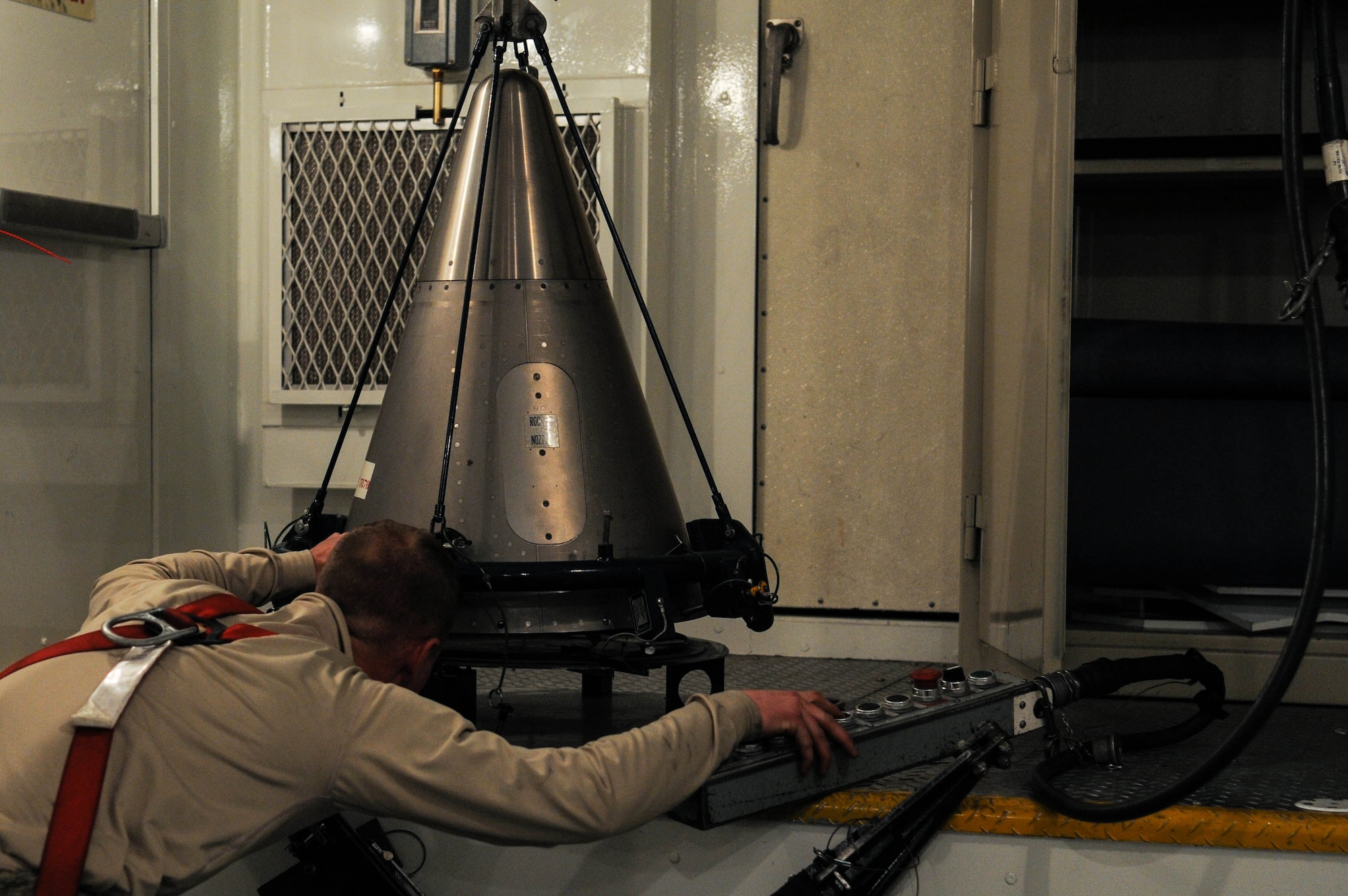 Senior Airman Andrew Parrish, 90th Missile Maintenance Squadron topside technician, prepares the forward section, of a reentry system, for secure transportation, Feb. 2, 2018, in the F. E. Warren Air Force Base missile complex. 90th MMXS Airmen transport missile components and perform maintenance across a 9,600 square mile tristate area. Missile maintenance teams perform periodic maintenance to maintain the on-alert status for launch facilities, ensuring the success of the nuclear deterrence mission. (U.S. Air Force photo by Airman 1st Class Braydon Williams)
