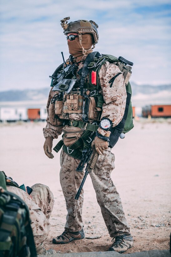 A Marine with 3rd Reconnaissance Battalion, 3rd Marine Division, III Marine Expeditionary Force prepares his gear at Marine Corps Air Ground Combat Center, Twentynine Palms, Calif., Feb. 13, 2018, as a part of Integrated Training Exercise 2-18. The purpose of ITX is to create a challenging, realistic training environment that produces combat-ready forces capable of operating as an integrated MAGTF. (U.S. Marine Corps Photo by Pfc. William Chockey)