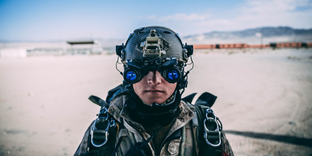 A Marine with 3rd Reconnaissance Battalion, 3rd Marine Division, III Marine Expeditionary Force preforms an operations on his Binocular Night Vision System M953 at Marine Corps Air Ground Combat Center, Twentynine Palms, Calif., Feb. 13, 2018, as a part of Integrated Training Exercise 2-18. The purpose of ITX is to create a challenging, realistic training environment that produces combat-ready forces capable of operating as an integrated MAGTF. (U.S. Marine Corps Photo by Pfc. William Chockey)