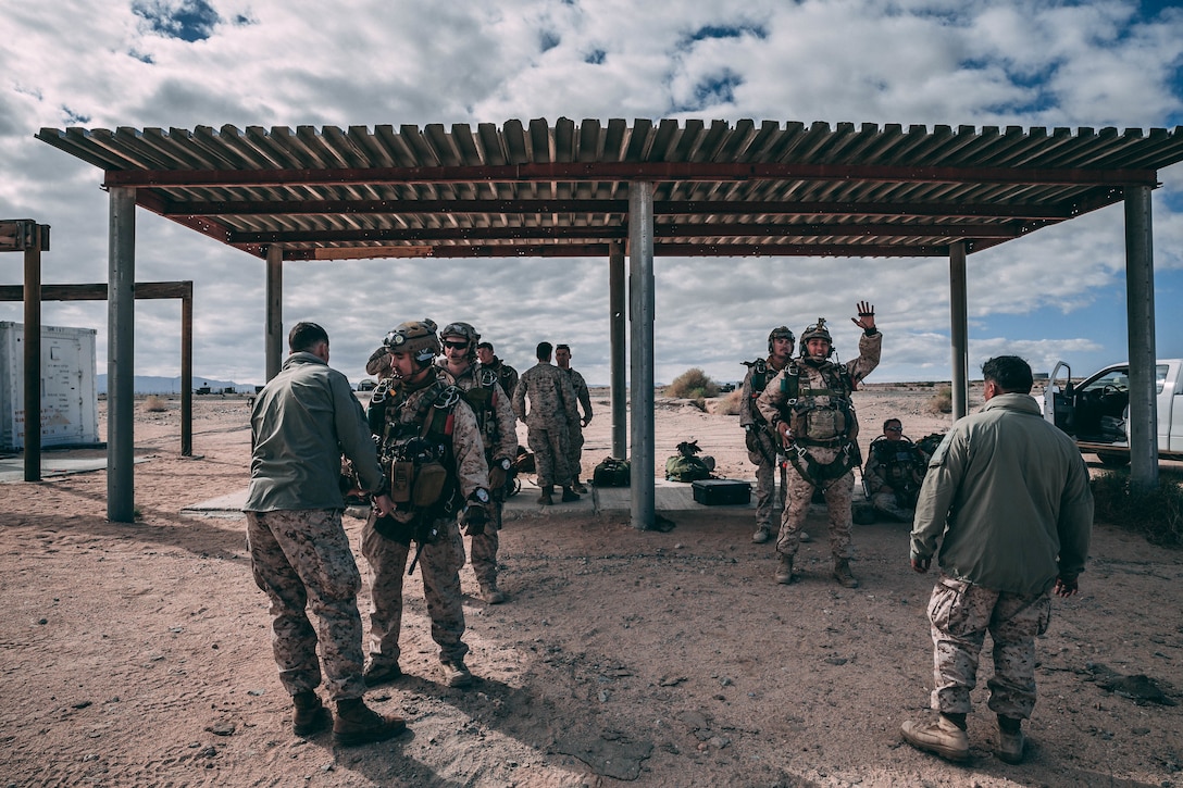 Marines with 3rd Reconnaissance Battalion, 3rd Marine Division, III Marine Expeditionary Force prepare their gear at Marine Corps Air Ground Combat Center, Twentynine Palms, Calif., Feb. 13, 2018, as a part of Integrated Training Exercise 2-18. The purpose of ITX is to create a challenging, realistic training environment that produces combat-ready forces capable of operating as an integrated MAGTF. (U.S. Marine Corps Photo by Pfc. William Chockey)