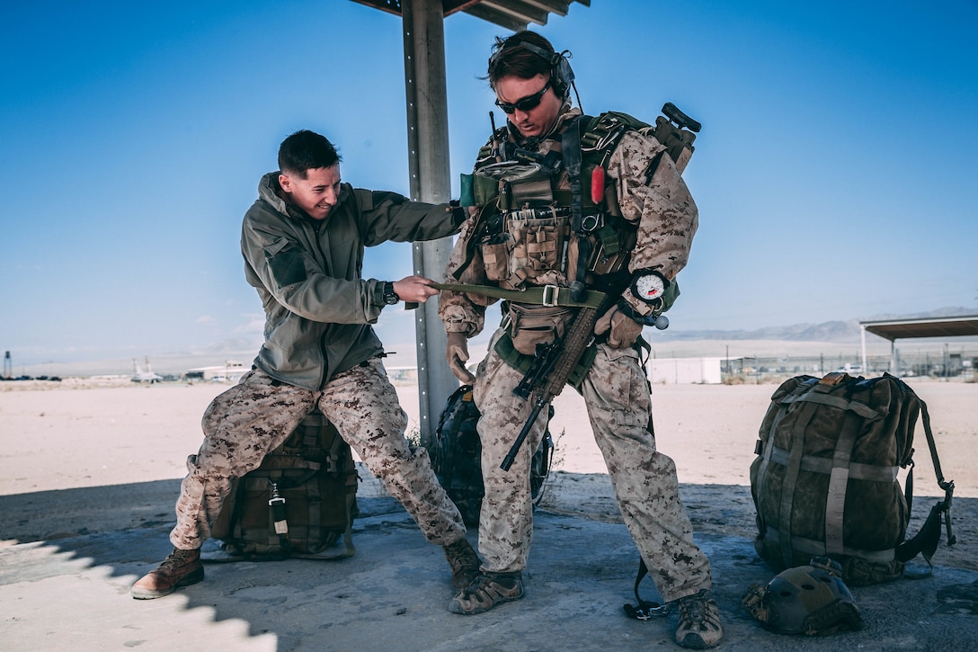 Marines with 3rd Reconnaissance Battalion, 3rd Marine Division, III Marine Expeditionary Force prepare their gear at Marine Corps Air Ground Combat Center, Twentynine Palms, Calif., Feb. 13, 2018, as a part of Integrated Training Exercise 2-18. The purpose of ITX is to create a challenging, realistic training environment that produces combat-ready forces capable of operating as an integrated MAGTF. (U.S. Marine Corps Photo by Pfc. William Chockey)