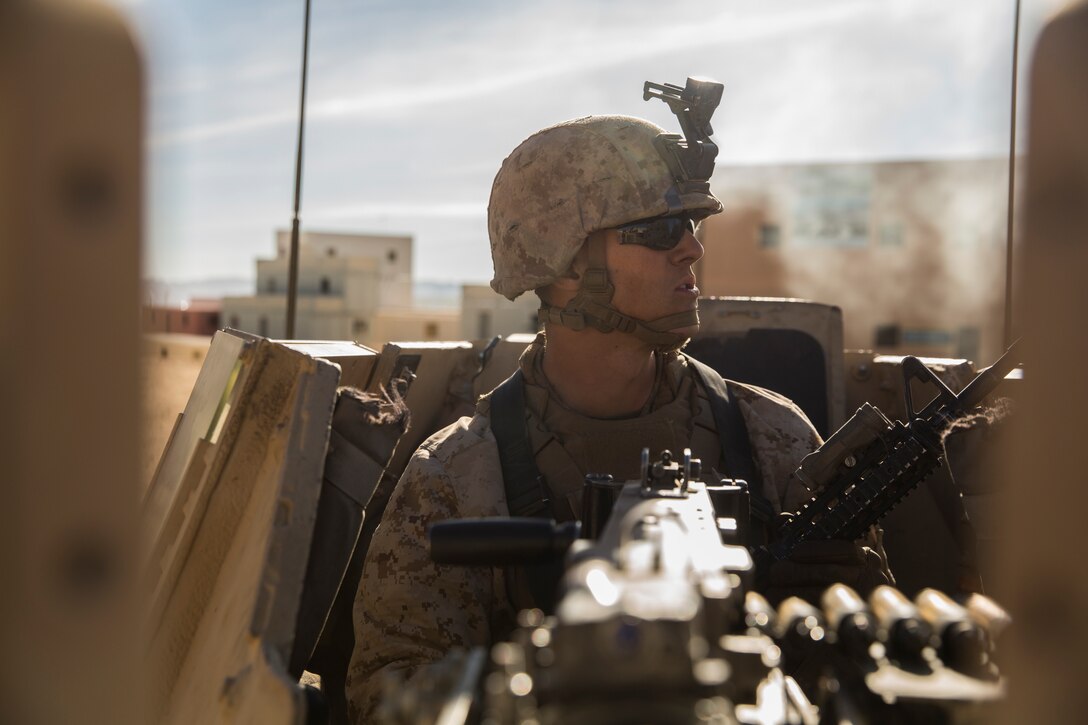Pfc. Jacob Bonczkowski, machine gunner, 3rd Battalion, 7th Marine Regiment, observes the surrounding area at Range 220 aboard the Marine Corps Air Ground Combat Center, Twentynine Palms, Calif., Feb. 9, 2018 as part of Integrated Training Exercise 2-18. The purpose of ITX is to create a challenging, realistic training environment that produces combat-ready forces capable of operating as an integrated MAGTF. (U.S. Marine Corps photo by Lance Cpl. Margaret Gale)
