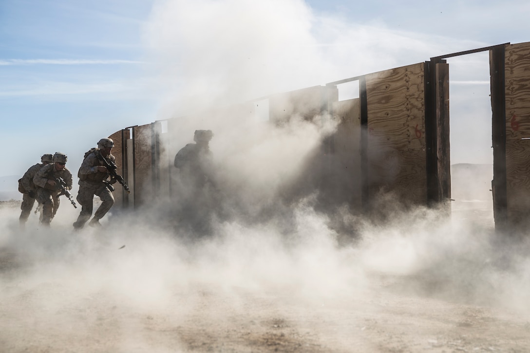 Marines with 3rd Battalion, 7th Marine Regiment, participate in door breaching training at Range 220 aboard the Marine Corps Air Ground Combat Center Twentynine Palms, Calif., Feb. 9, 2018 as part of Integrated Training Exercise 2-18. The purpose of ITX is to create a challenging, realistic training environment that produces combat-ready forces capable of operating as an integrated MAGTF. (U.S. Marine Corps photo by Lance Cpl. Margaret Gale)