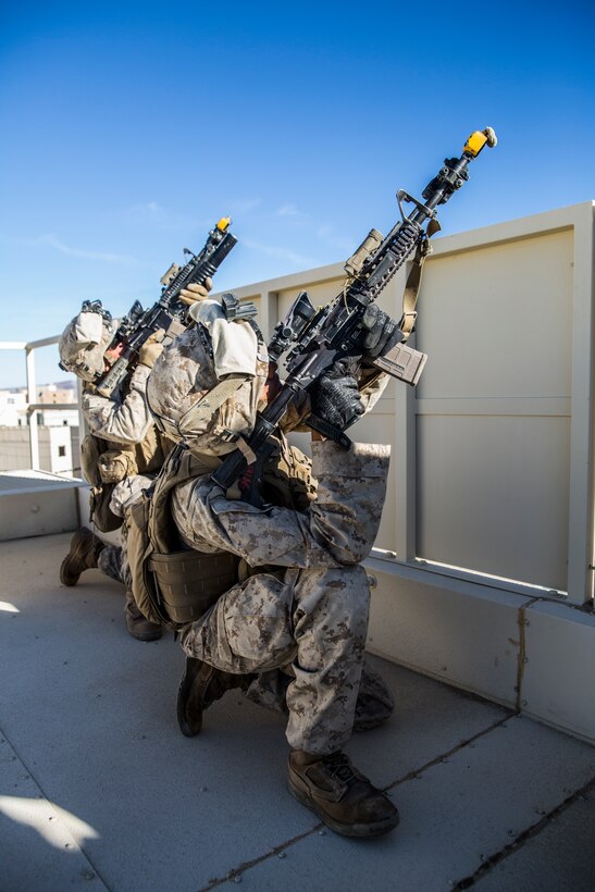 Marines with 3rd Battalion, 7th Marine Regiment, inspect a flying drone for threats at Range 220 aboard the Marine Corps Air Ground Combat Center Twentynine Palms, Calif., Feb. 9, 2018 as part of Integrated Training Exercise 2-18. The purpose of ITX is to create a challenging, realistic training environment that produces combat-ready forces capable of operating as an integrated MAGTF. (U.S. Marine Corps photo by Lance Cpl. Margaret Gale)