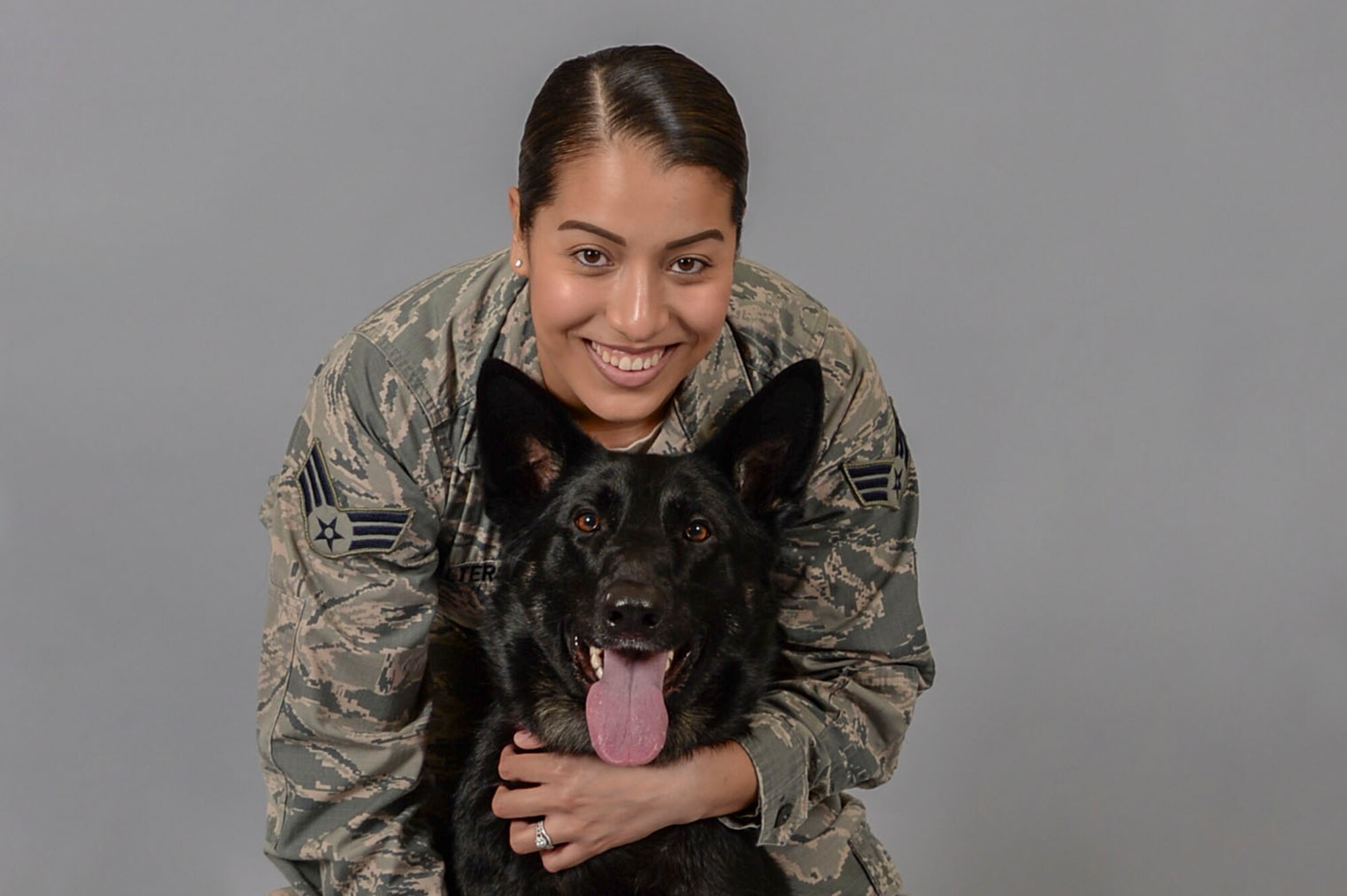 Senior Airman Katherine Walters, 375th Air Mobility Wing Public Affairs broadcast journalist, and her German Shepherd, Jodi, have been utilizing the Scott Air Force Base Veterinary Treatment Facility for two years. (U.S. Air Force photo by Senior Airman Melissa Estevez)
