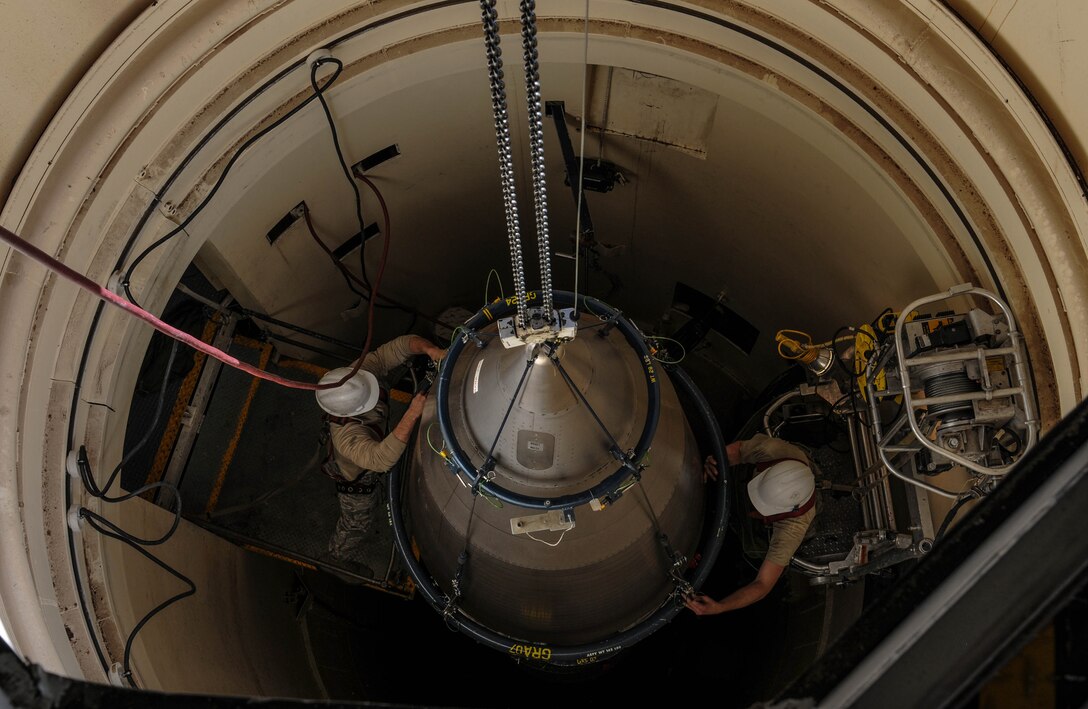 Airmen from the 90th Missile Maintenance Squadron prepare a reentry system for removal from a launch facility, Feb. 2, 2018, in the F. E. Warren Air Force Base missile complex. The 90th MMXS is the only squadron on F. E. Warren allowed to transport warheads from the missile complex back to base. Missile maintenance teams perform periodic maintenance to maintain the on-alert status for launch facilities, ensuring the success of the nuclear deterrence mission. (U.S. Air Force photo by Airman 1st Class Braydon Williams)