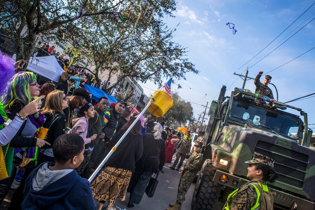 Marines participate in a parade during Mardi Gras festivities in New Orleans.