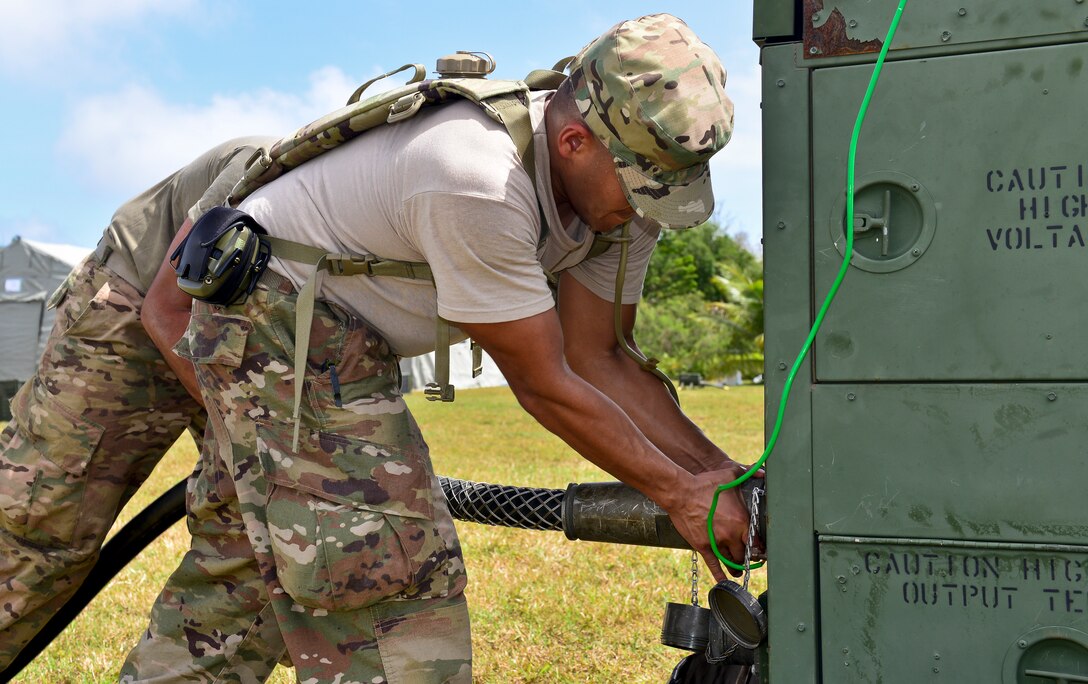 U.S. Air Force Master Sgt. Carlo Narvasa, 36th Contingency Response Group flight chief of operations, sets up a power unit during exercise COPE NORTH 2018 at Rota, U.S. Commonwealth of the Northern Mariana Islands, Feb. 17. An annual exercise, this year's COPE NORTH is a multilateral HA/DR exercise that allows participating nations to prepare for and recover from the devastating effects of natural disasters. (U.S. Air Force photo by Airman 1st Class Christopher Quail)