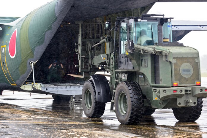 U.S. Air Force and Koku Jieitai (Japanese Air Self-Defense Force) humanitarian assistance/disaster relief personnel unload a Koku Jieitai C-130H Hercules in support of exercise COPE NORTH 2018 at Rota, U.S. Commonwealth of the Northern Mariana Islands, Feb. 17. An annual exercise, this year's COPE NORTH is a multilateral HA/DR exercise that allows participating nations to prepare for and recover from the devastating effects of natural disasters. (U.S. Air Force photo by Airman 1st Class Christopher Quail)