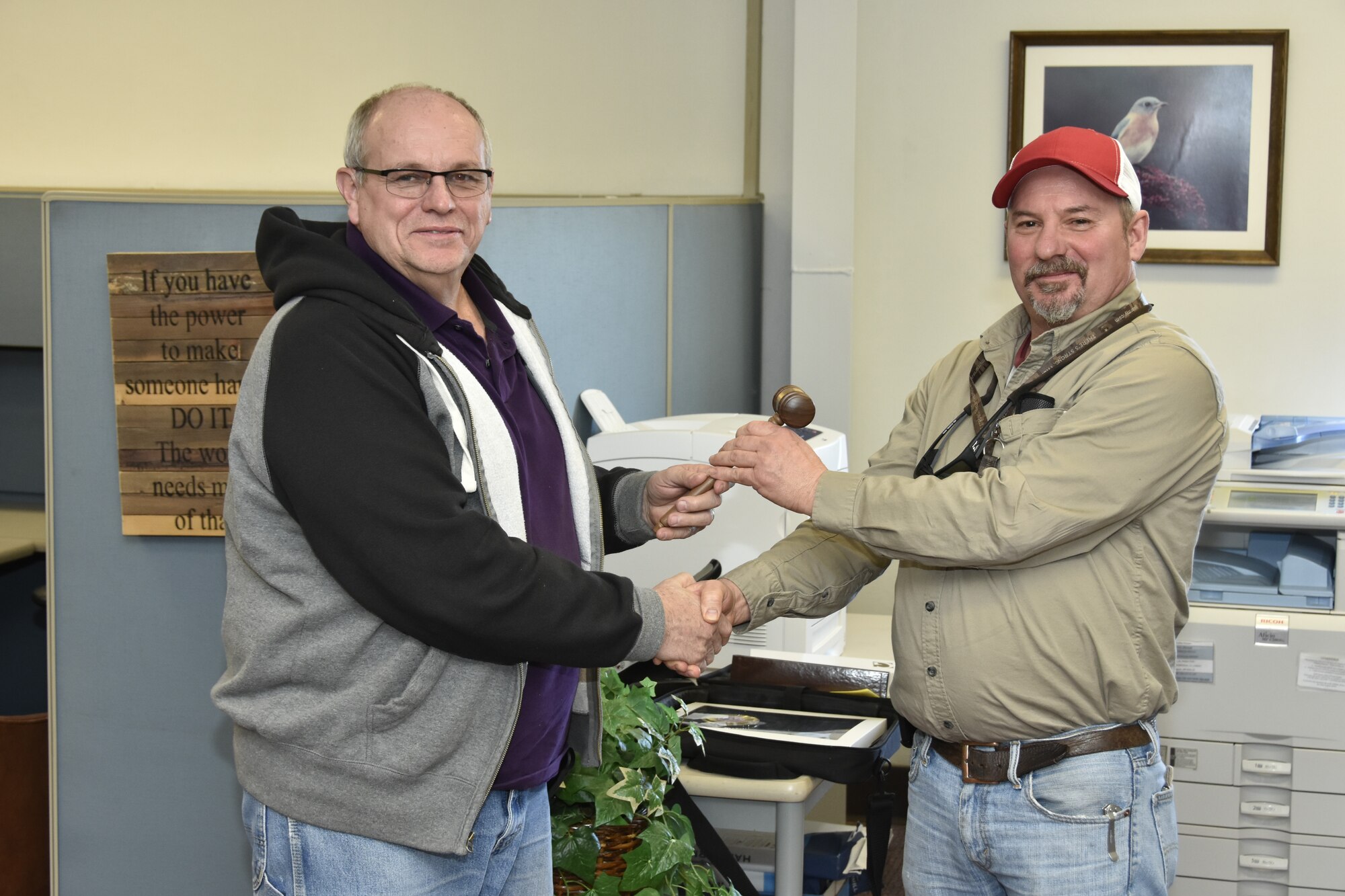 The Air Engineering Metal Trades Council recently installed new officers. Above, outgoing President Jay Vandergriff, left, hands the gavel to the AEMTC’s recently elected President Alvin Cleek. (U.S. Air Force photo/Rick Goodfriend)