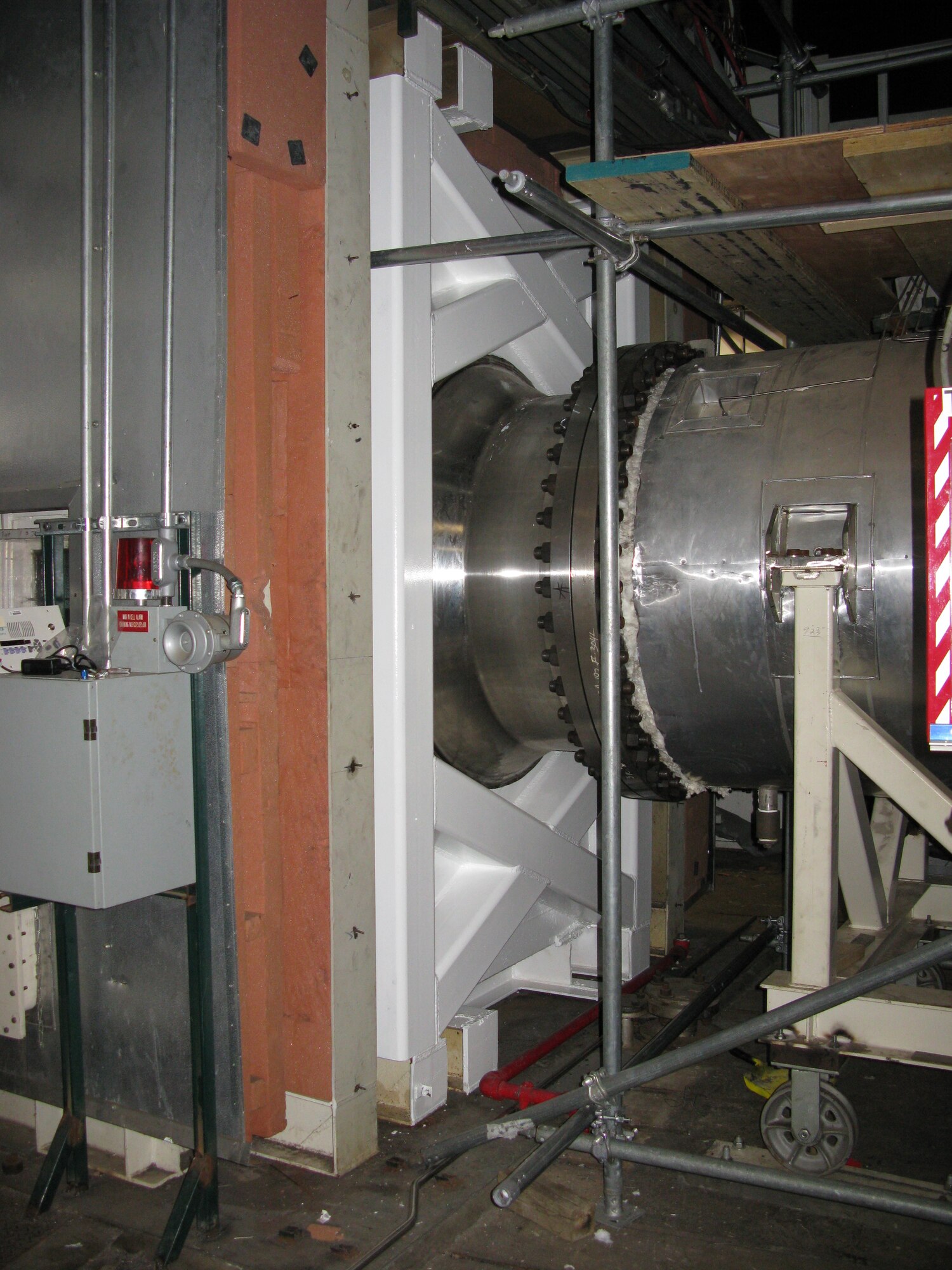 The plenum for the AEDC T-11 engine test cell at Arnold Air Force Base was modified by installing a spool piece that enabled the installation of a plenum apparatus and provided the interface for the plug-in modules. Pictured is an outside view of the plenum modification. (AEDC photo)