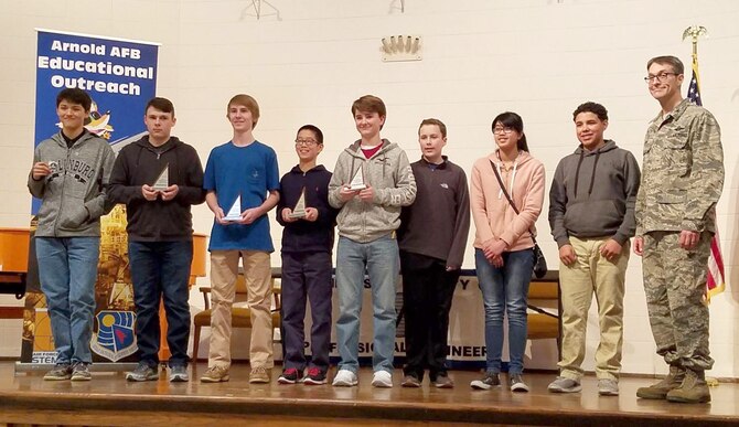Winners of the MathCounts® competition Feb. 3 at University of Tennessee Space Institute receive their awards from AEDC Commander Col. Scott Cain. The Arnold Air Force Base Science, Technology, Engineering and Mathematics (STEM) Outreach Program sponsored five MathCounts® Teams, comprised of a total of 46 students. This competition, which challenges students to solve math problems, is only one of many engineering activities that lead up to National Engineers Week, Feb. 18-24. Winners of the competition will be combined into a team that will compete at the state level and possibly at the national level. Students in seventh and eighth grades from Bedford, Coffee, Franklin and Lincoln counties participated in this recent competition. The event is also sponsored by the Tennessee Society of Professional Engineers. Pictured left to right are: Kyler Cantrell, St. Andrews-Sewanee School; Jaxon Bennett, East Middle School; D.J. Dillehay, East Middle School; Franklin Zhang, East Middle School; Cannon Emory, East Middle School; Jackson Banks, East Middle School; Garnet Cuello, East Middle School; Alexander Camron, West Middle School; Col. Scott Cain, AEDC Commander. (Courtesy photo)