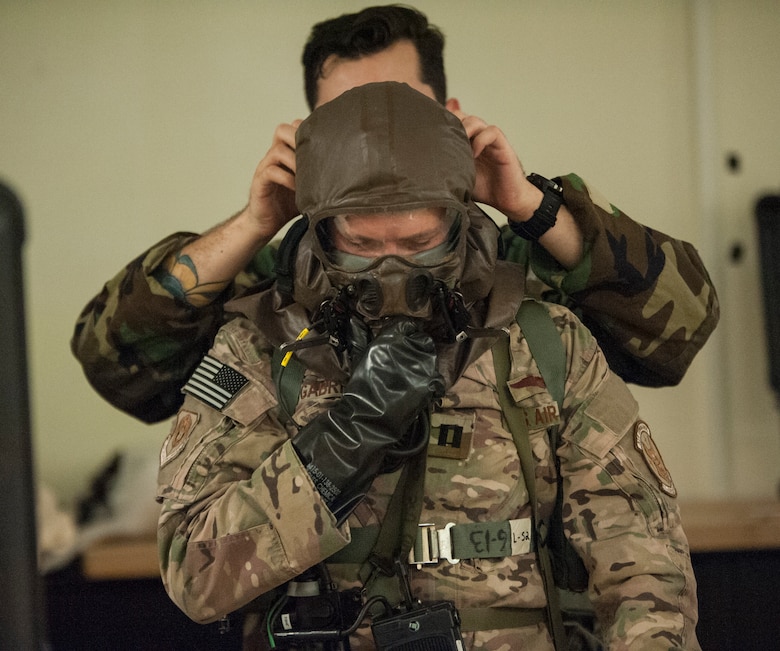 Aircrew conduct inflight training with protective gear > Air Force