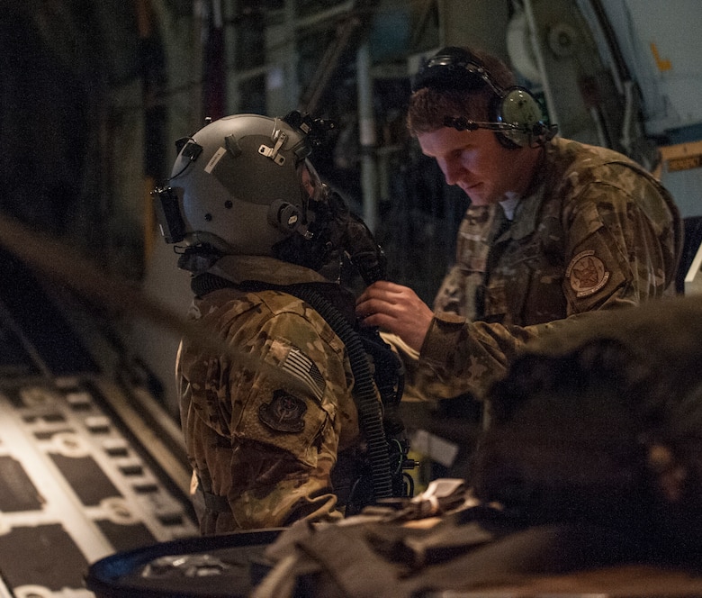 Aircrew conduct inflight training with protective gear