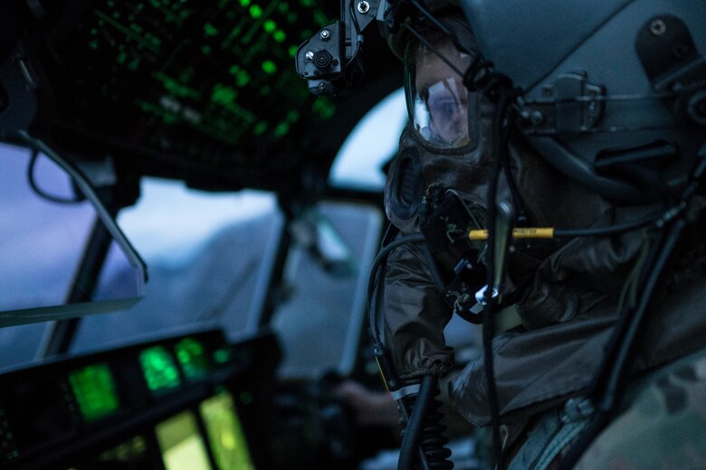 Aircrew conduct inflight training with protective gear > Air Force