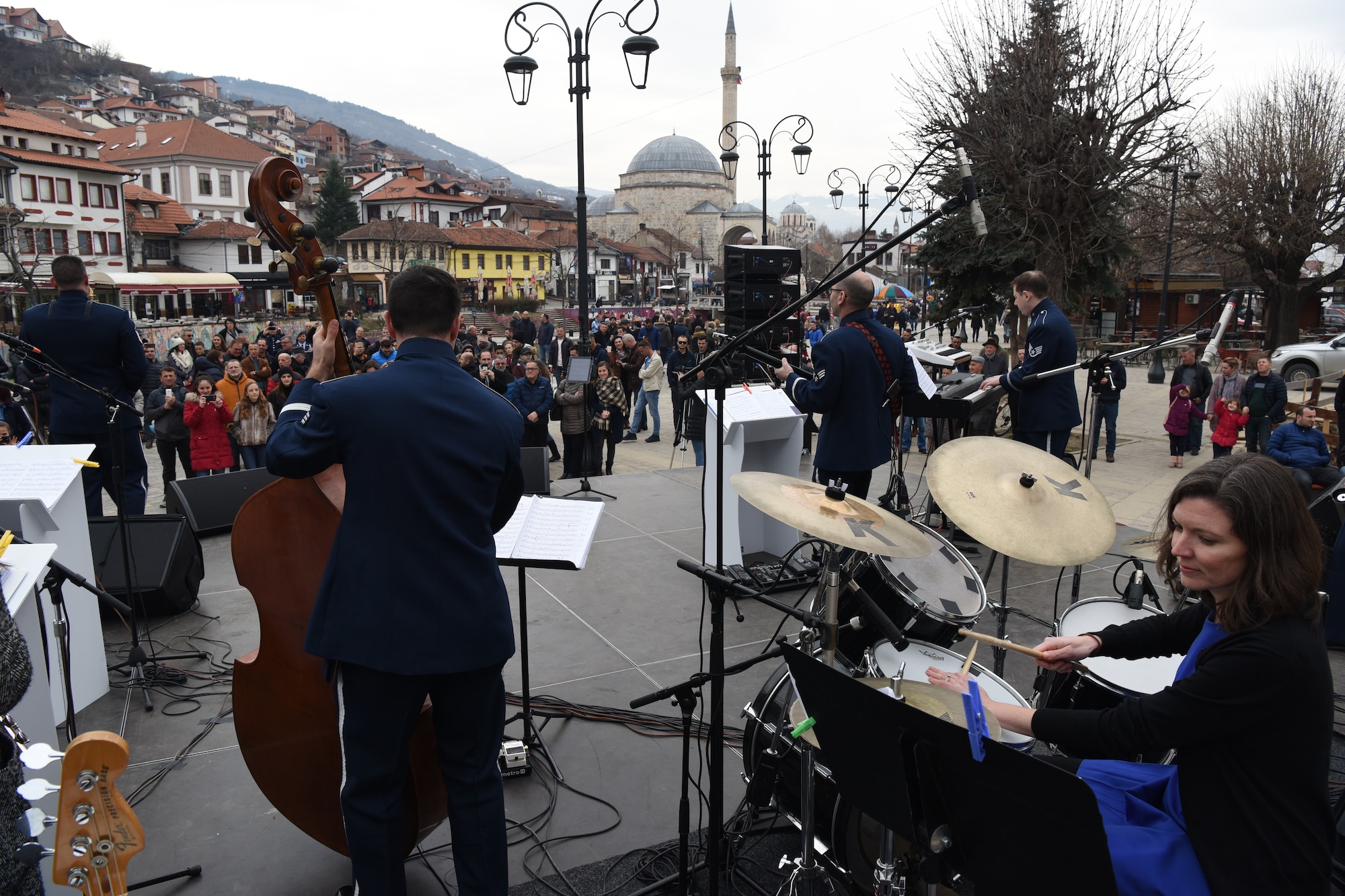 The U.S. Air Forces in Europe Band performs in Prizren, Kosovo, in celebration of the country’s 10th anniversary of independence, Feb. 18, 2018. Sitting in on drums is Erin Mains, a public diplomacy officer at the U.S. Embassy in Pristina. (U.S. Air Force photo by Maj. Tristan Hinderliter)
