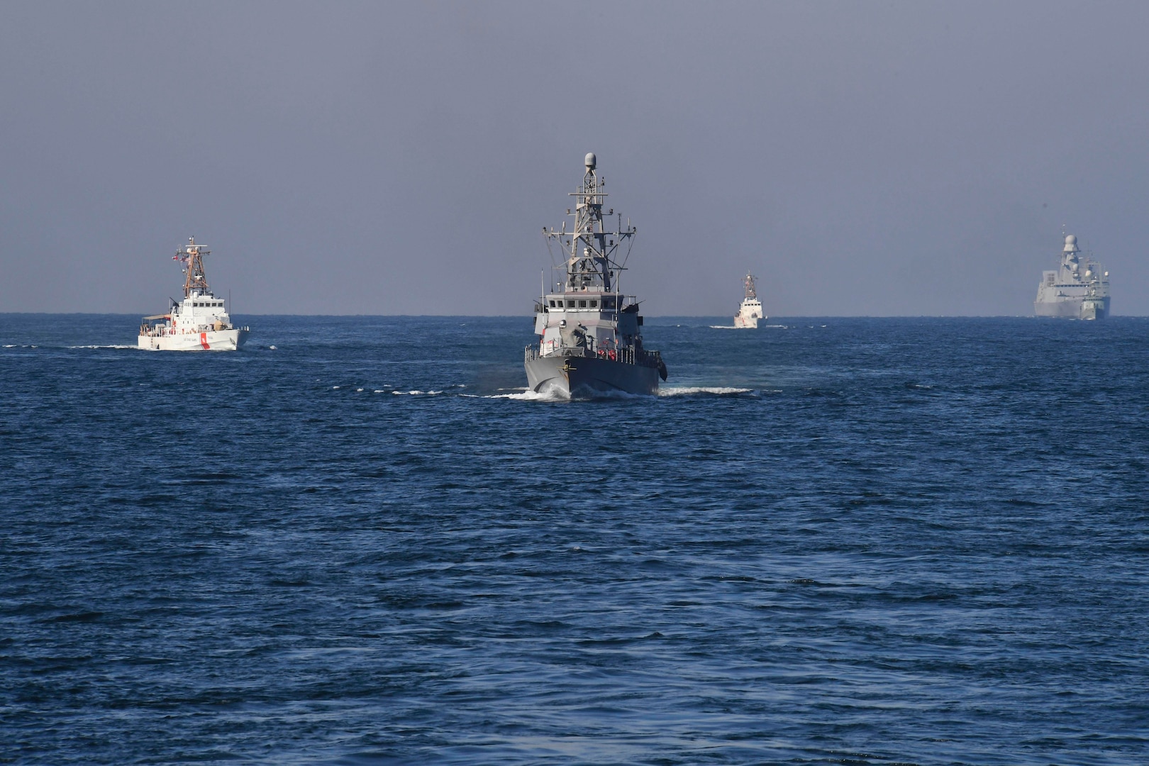 180206-N-TB177-0558 U.S. 5TH FLEET AREA OF OPERATIONS (Feb. 6, 2018) Ships from the U.S. Navy, U.S. Coast Guard, Royal Navy of Oman and France’s Marine Nationale practice maneuvering techniques during exercise Khunjar Haad. Khunjar Haad  is a multilateral, surface, air and explosive ordnance disposal exercise with the U.S. Navy, U.S. Coast Guard, Royal Navy of Oman, France’s Marine Nationale and United Kingdom’s Royal Navy in order to enhance interoperability, mutual capability and support long-term regional cooperation of forces in the Arabian Gulf. (U.S. Navy photo by Mass Communication Specialist 2nd Class Kevin J. Steinberg/Released)