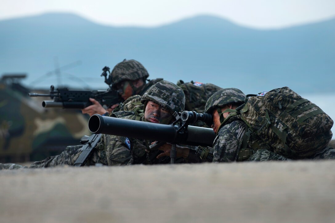 South Korean Marines provide security overwatch during an amphibious assault.