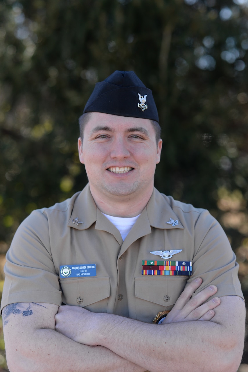 A Navy petty officer poses for a photo.