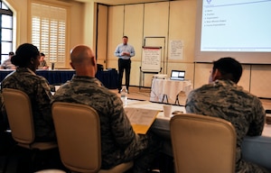 Phil Chansler, assistant professor of operations management with Air Education and Training Command, Maxwell Air Force Base, Ala., conducts a continuous process improvement course Feb. 15, 2018, at Joint Base Charleston, S.C.