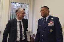 Lord Mayor Dr. Klaus Weicheland, Kaiserslautern mayor and U.S Air force Lt. Gen. Richard Clark, Third Air Force commander, trade stories at the German-American Community Office’s 15th Anniversary ceremony Feb. 15, 2018, in Kaiserslautern, Germany. Both Klaus and Clark were scheduled to speak on the success of GACO and its future role in the KMC.