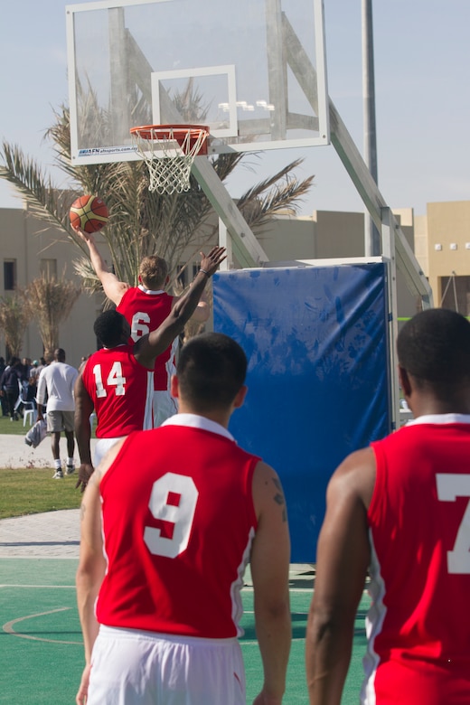 U.S. Soldiers and Sailors play basketball.