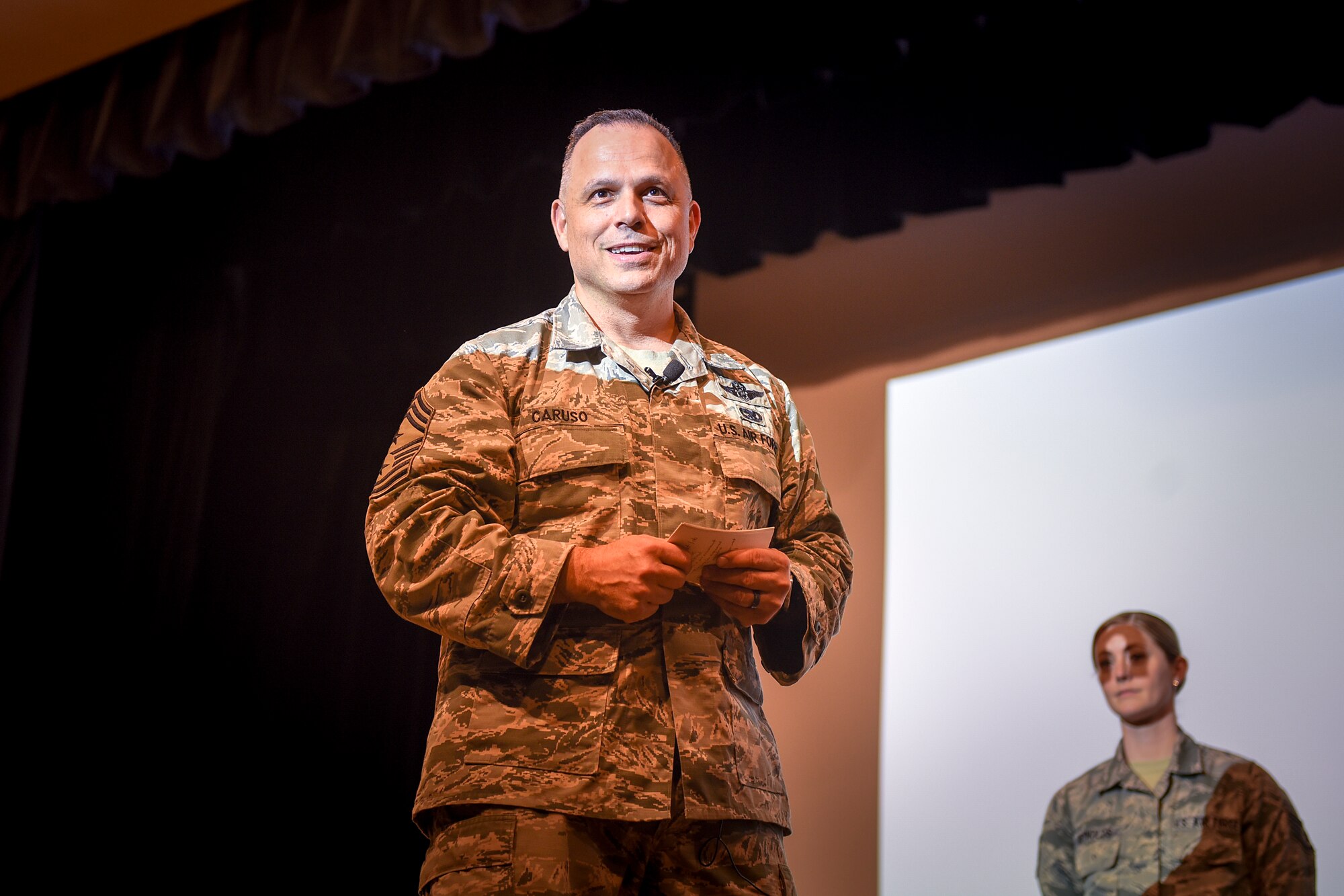 Chief Master Sgt. Matthew Caruso, command senior enlisted leader of U.S. Transportation Command, speaks to senior NCOs Feb. 15, 2018, during an all call at the theater on Seymour Johnson Air Force Base, North Carolina.