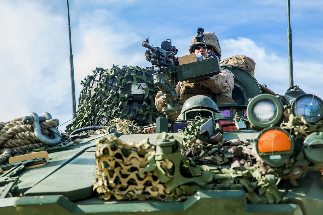 Marines maneuver their tactical vehicle during raid training.