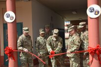 Maj. Gen. Bruce Hackett, commanding General of the 80th Training Command, and Brig. Gen. Hector Lopez, commanding general of the 94th Training Division, take part in the ribbon-cutting ceremony at Fort Buchanan, Puerto Rico to celebrate the reopening and relocation of a schoolhouse for the 94th Training Division's 5th Battalion on 13 February 2018. The 5th BN's previous schoolhouse was severely damaged by the devastation of Hurricane Maria. Maj. Gen. Hackett and Brig. Gen. Lopez were also on the island to assist with the planned tranistion and approved reassignment of all units stationed in Puerto Rico to the operational control of the 1st Mission Support Command.

Photo by Army Major Ebony Malloy, 94th Training DIV-FS Public Affairs