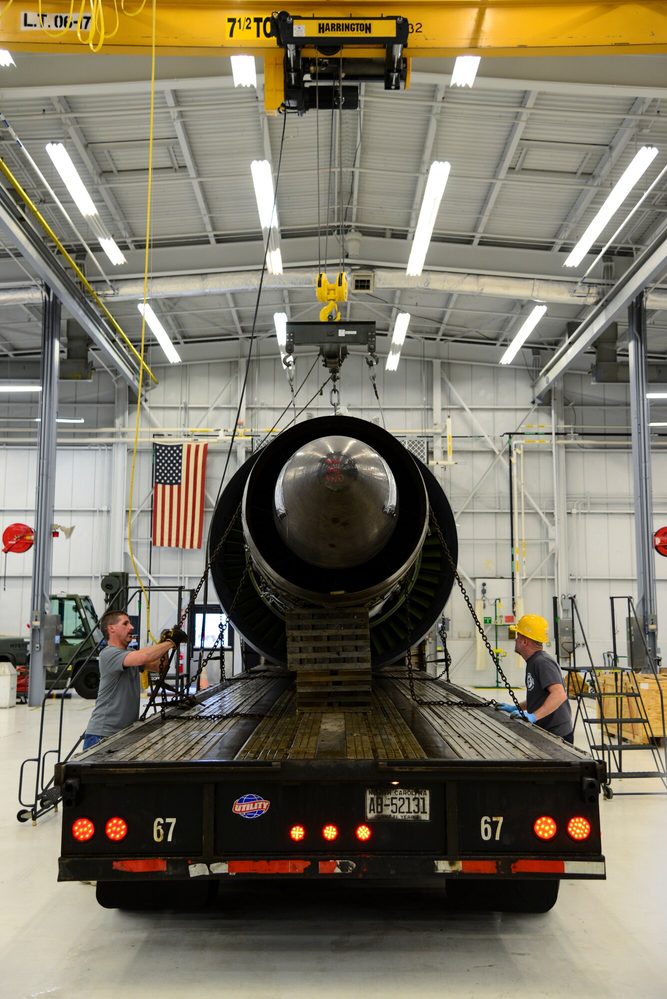 Wesley Currin (left), Triple J Trucking driver from Jacksonville, N.C., and Michael Tatum, 436th Maintenance Squadron aerospace propulsion engine mechanic, secure the last production General Electric TF-39 turbofan engine to a tractor trailer Feb. 16, 2018, at Dover Air Force Base, Del. Since 2015, 144 TF-39 engines were turned in through a joint process involving the Air Force and General Electric, where they were sold to a metals reclamation company in Monroe, N.C. (U.S. Air Force photo by Staff Sgt. Aaron J. Jenne)