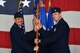U.S. Air Force Lt. Col. Charles Fallon, 55th Fighter Squadron (FS) commander, right, receives the 55th FS guidon from Col. Brian Jackson, 20th Operations Group commander, during a change of command ceremony at Shaw Air Force Base, S.C., Feb. 20, 2018.