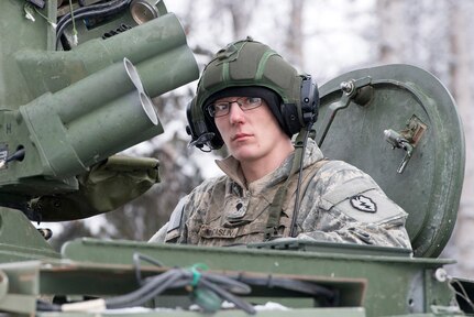 Spc. Austin McCaslin, assigned to Bayonet Company, 1st Battalion, 5th Infantry Regiment, 1st Stryker Brigade Combat Team, 25th Infantry Division, U.S. Army Alaska, prepares for live-fire gunnery training during Operation Punchbowl at Joint Base Elmendorf-Richardson, Alaska, Feb. 16, 2018. Operation Punchbowl was a battalion-level, combined arms, live-fire exercise that focused on arctic lethality.