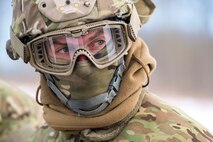 Staff Sgt. Patrick Wilson, 91st Security Forces Group response force leader, watches a defender perform self-aid buddy care on a simulated casualty in the Turtle Mountain State Forest, N.D., Feb. 14, 2018. After performing SABC, 91st SFG defenders vectored in a 54th Helicopter Squadron UH-1N Iroquois to evacuate the casualty. (U.S. Air Force photo by Senior Airman J.T. Armstrong)