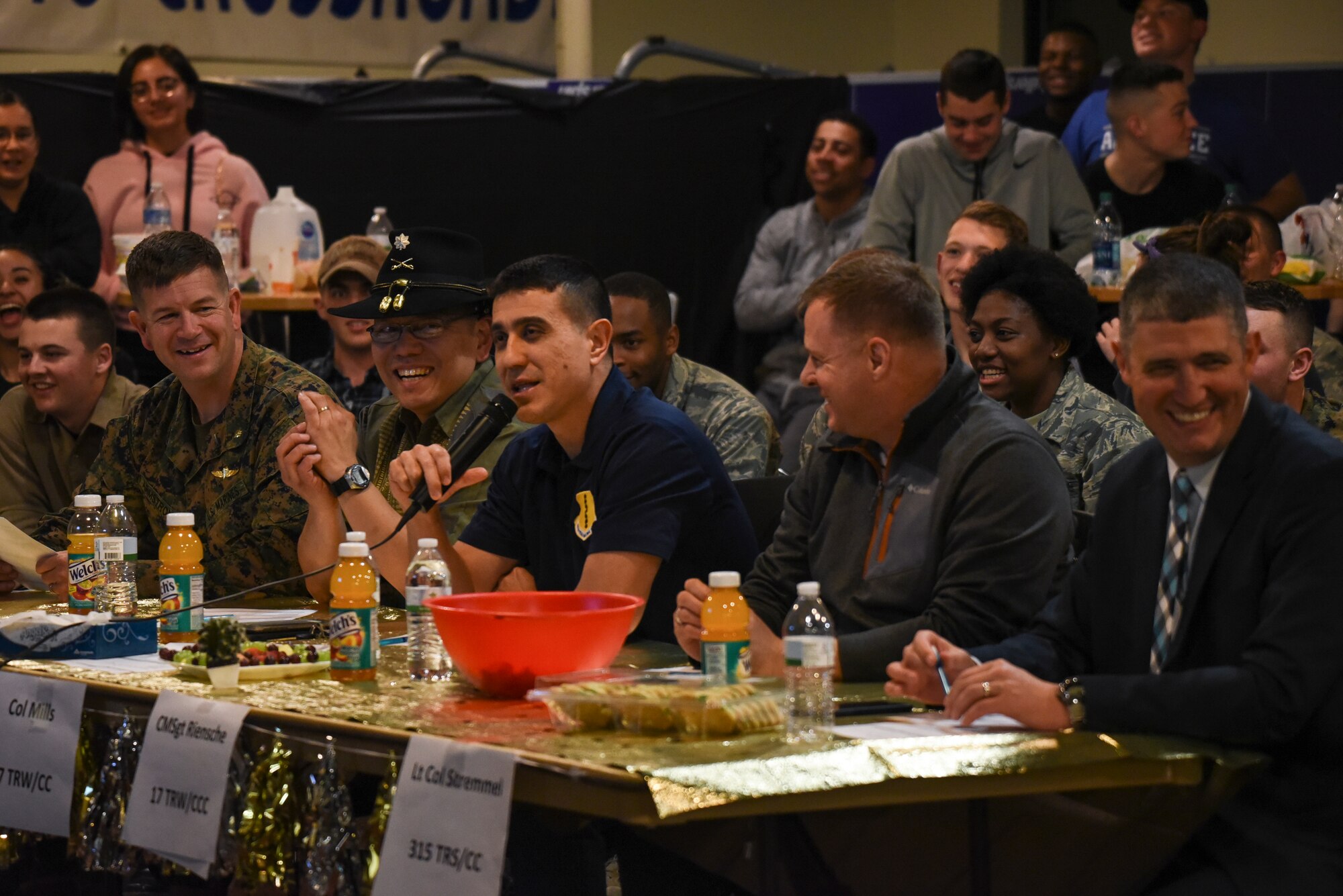 U.S. Air Force Col. Ricky Mills, 17th Training Wing commander, speaks with the other judges, U.S. Marine Maj. Andrew Armstrong, Marine Corps Detachment commanding officer, U.S. Army Lt. Col. Yukio Kuniyuki, 344th Military Intelligence Battalion commander, U.S. Air Force Maj. Melvin Smith, chaplain, and U.S. Air Force Lt. Col. Kenneth Stremmel, 315th Training Squadron commander, during the 11th Annual Talent Show at the Crossroads on Goodfellow Air Force Base, Texas, Feb. 16, 2018. The judges picked their favorite performers out of the 11 competitors. (U.S. Air Force Photo by Airman 1st Class Zachary Chapman/Released)