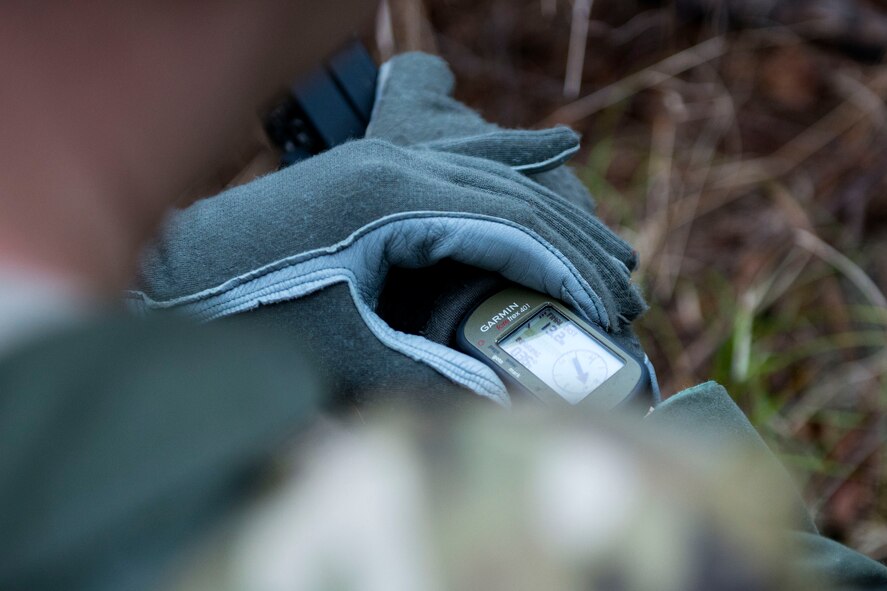 Capt. John, 41st Rescue Squadron HH-60G Pave Hawk pilot, examines his GPS during combat survival training (CST), Feb. 13, 2018, at Moody Air Force Base, Ga. CST prepares Airmen to operate in various combat situations and also instills navigation skills in the event they become isolated.
(U.S. Air Force photo by Airman 1st Class Erick Requadt)