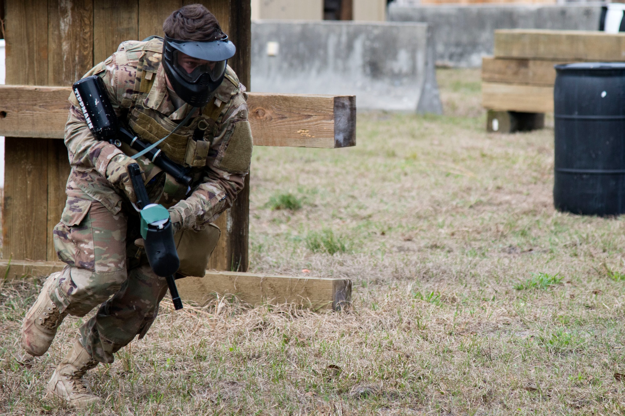 Airman 1st Class Elijah Bishop, 347th Operations Support Squadron intel analyst, runs to cover during a Tactical Combat Casualty Care course, Feb. 14, 2018, at Moody Air Force Base, Ga. The training is designed to teach Airmen how to apply critical life-saving skills while engaged in a combat environment. (U.S. Air Force photo by Airman 1st Class Erick Requadt)